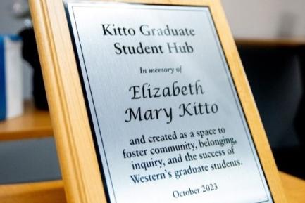 A plaque that says: “Kitto Graduate Student Hub, In Memory of Elizabeth Mary Kitto and created as a space to foster community, belonging, inquiry, and the success of Western’s graduate students. October 2023.”