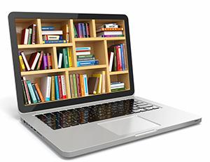 Open laptop with shelved books on the screen