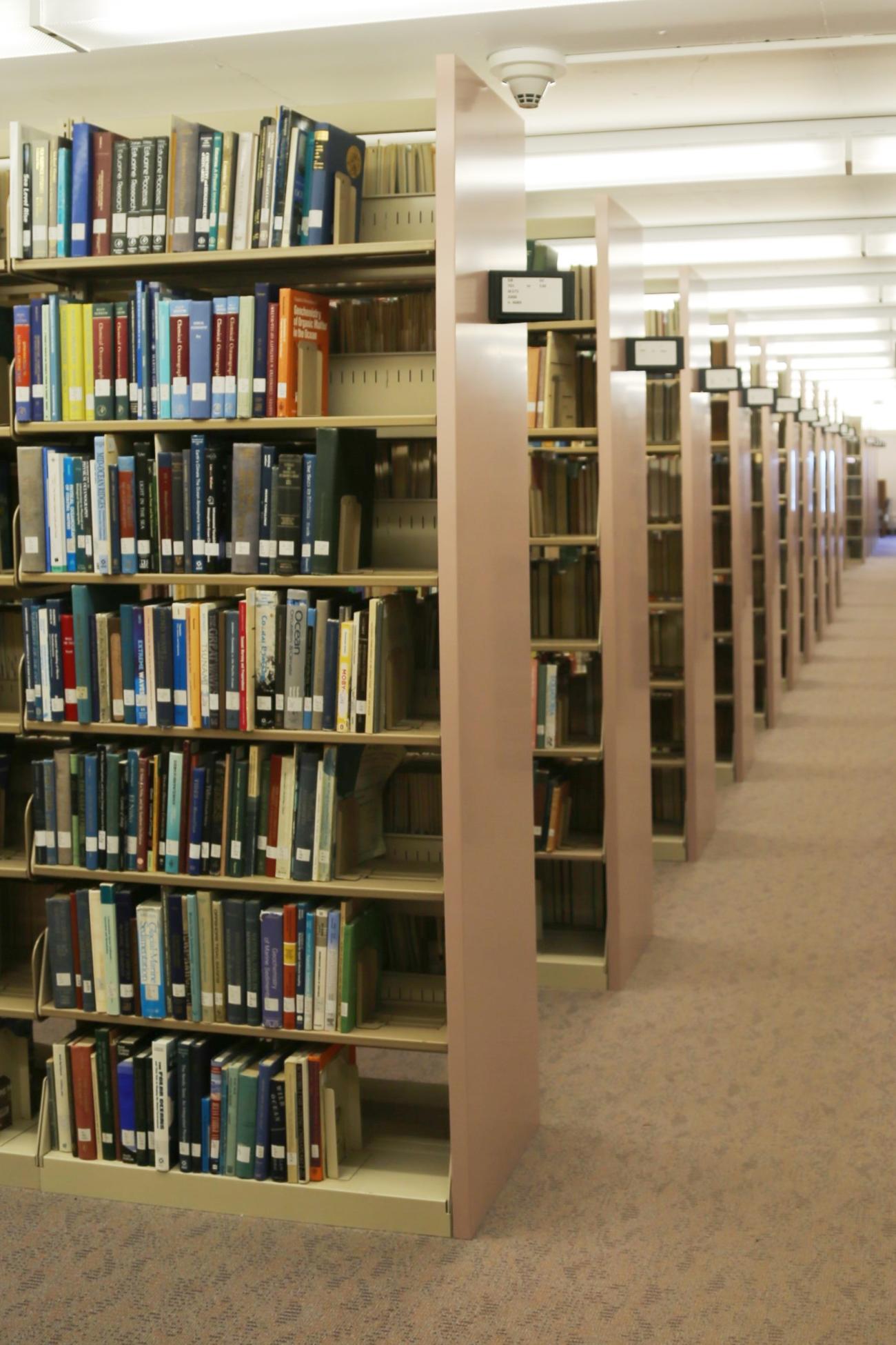 Countless rows of library stacks filled with books