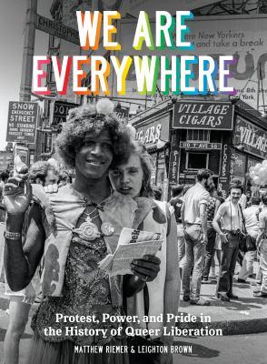 "We are Everywhere" in rainbow letters on black and white photo of young people in front of a store front titled Village Cigars
