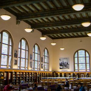 Wilson Library Reading Room, with tall rounded windows and view of the painted ceiling