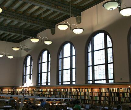 Large rounded windows and bookshelves in the Wilson Reading Room