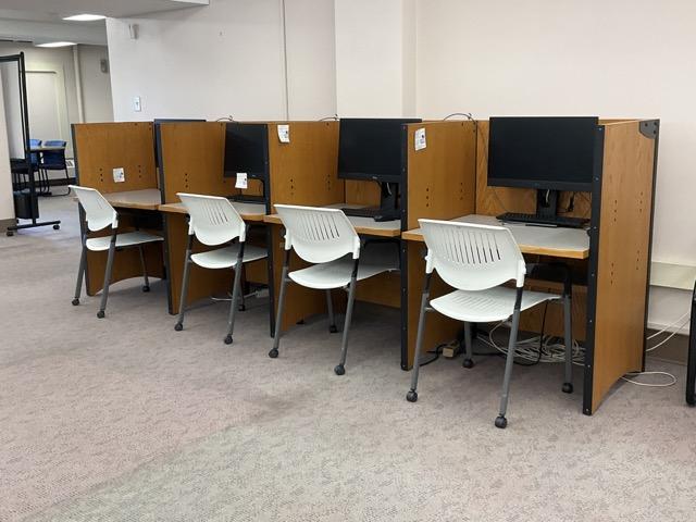 A row of computers in carrels